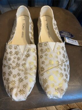 TOMS Cream Slip-On Flats with Gold Floral Accent